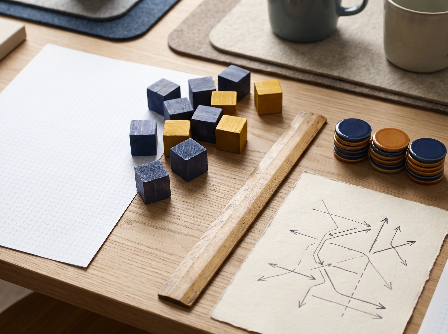 Game planning desk with wooden cubes, notes and tokens